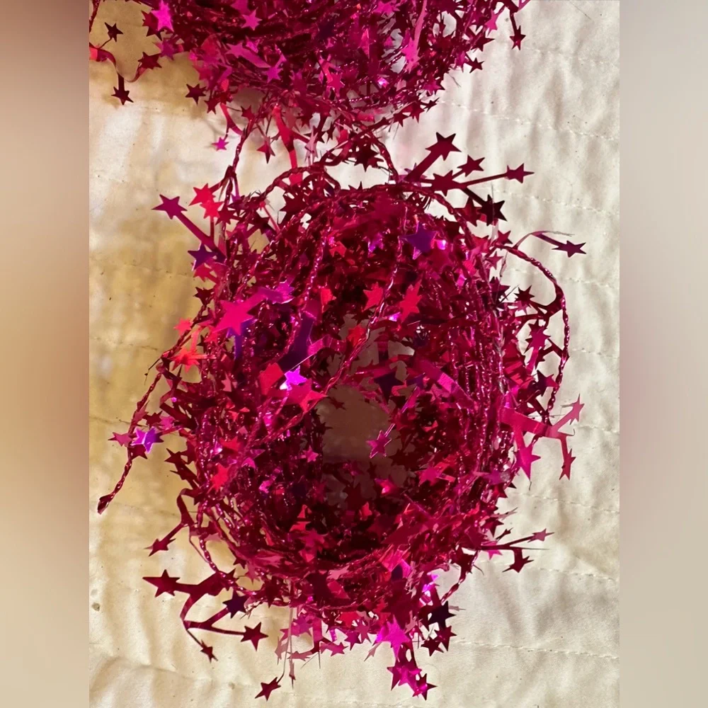 2 bundles of wired pink shimmery star garland - each about 25 feet long